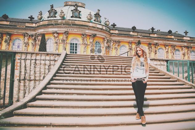 Pretty girl on the stairs of Sans Souci palace - image #183633 gratis