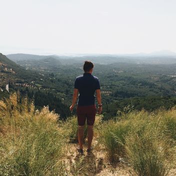 Boy looking on beautiful landscape in mountains - image gratuit #271683 