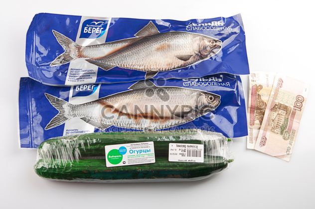 Fish, cucumbers, money on the table - Free image #272563