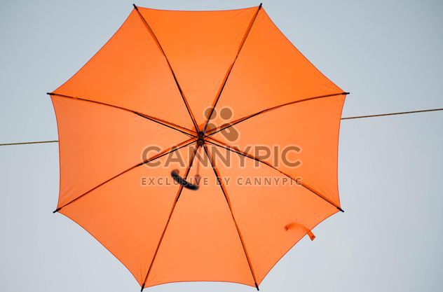 Orange umbrella hanging - image #273083 gratis
