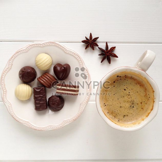Cup of coffee, candies and anise - image #329093 gratis