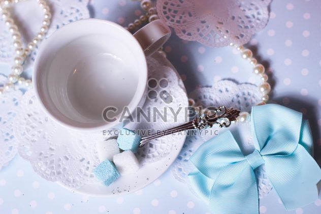 White cup and decorations on table - image gratuit #342083 