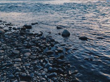 Stones in sea at sunset - Free image #344513