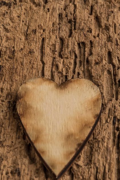Wooden heart on wooden background - бесплатный image #345093