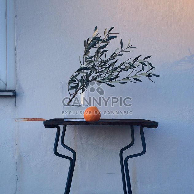 Olive branches in vase and orange - Free image #394813