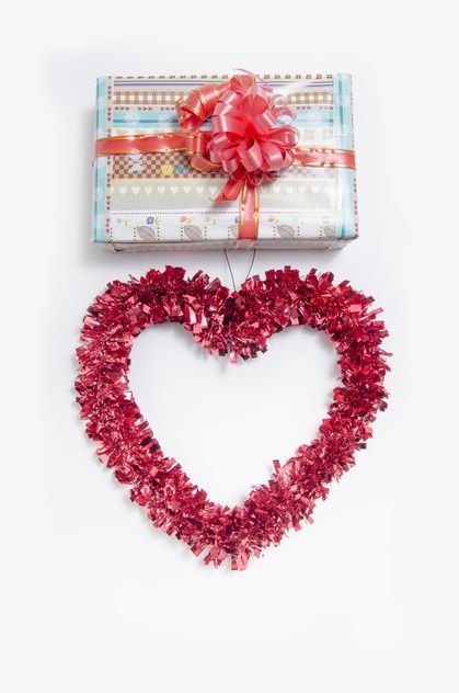 Decorated gift box and heart on white background - бесплатный image #452553