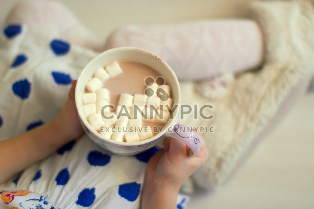 Mug of cocoa in child's hands - Free image #182563