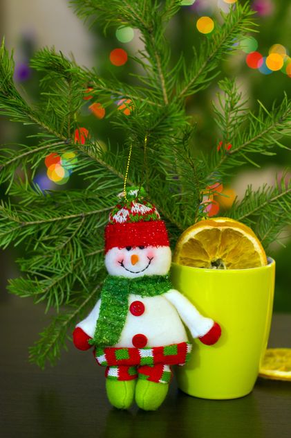 Christmas snowman, cup of tea and fir branch - Free image #182623