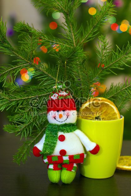Christmas snowman, cup of tea and fir branch - image #182623 gratis