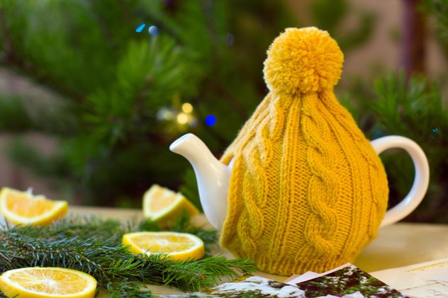 Teapot in knitted hat - image #182633 gratis
