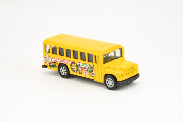 Yellow toy bus isolated on white background - Kostenloses image #182813