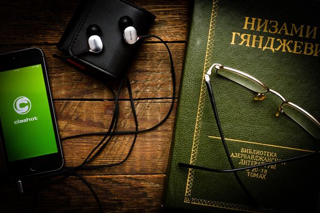Smartphone with earphones, book and glasses - image #182833 gratis
