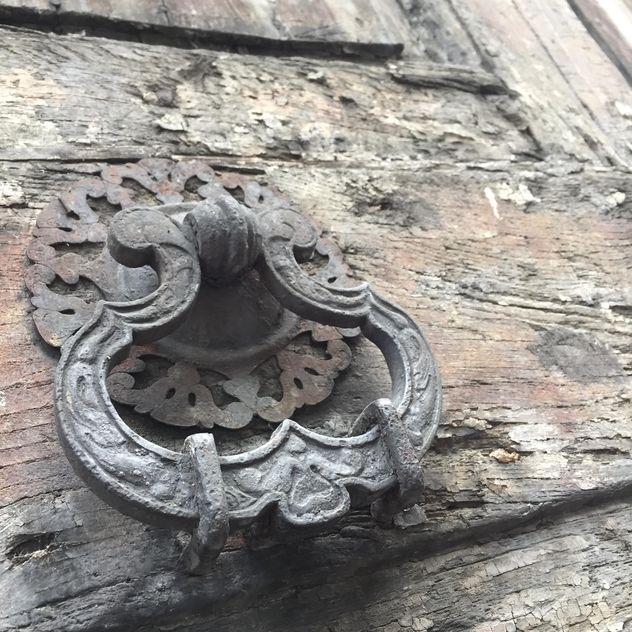 Closeup of old door knocker on wooden door - Free image #183123