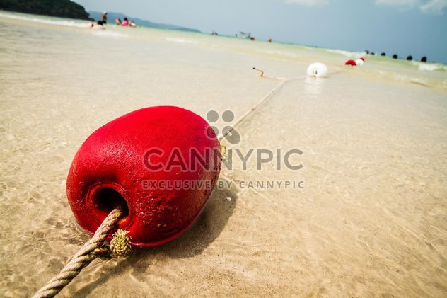 Red buoy on a sand - image #183433 gratis
