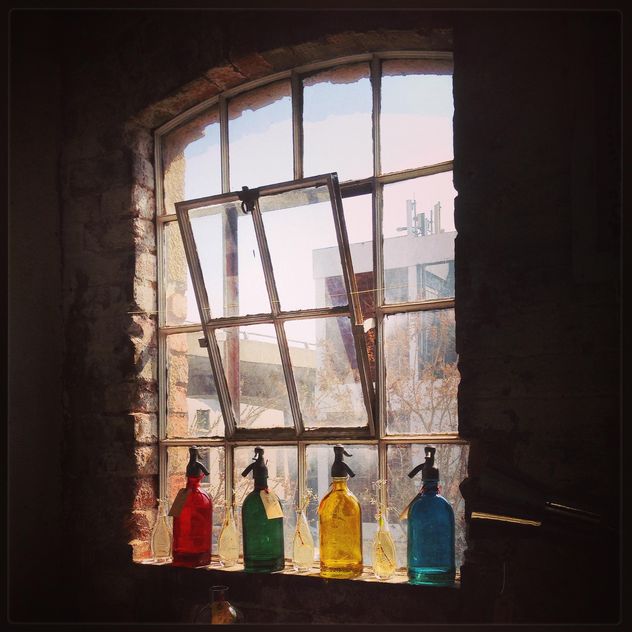 Colored bottles on the window - image #183573 gratis
