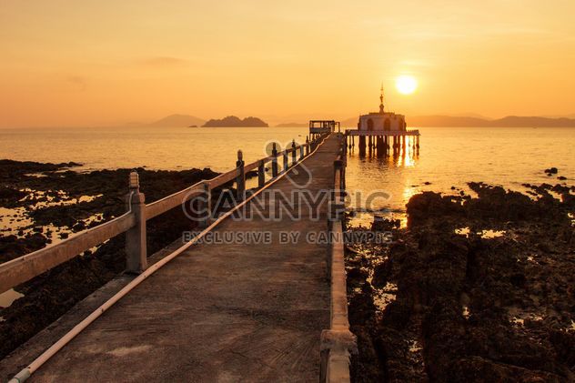 Bridge to temple in sea at sunset - image #183853 gratis