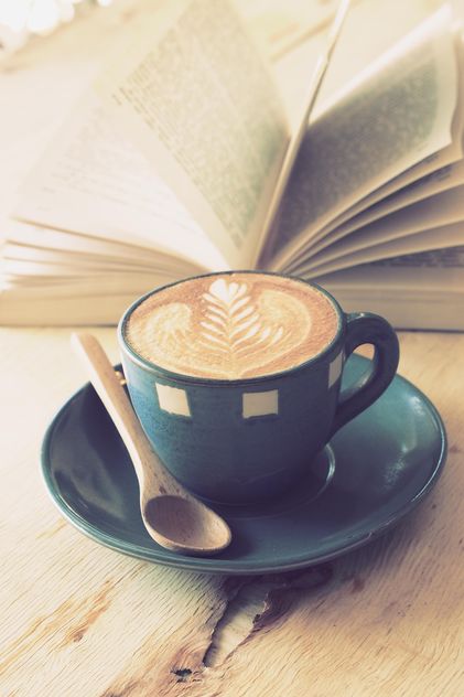 Coffee latte art and open book on wooden table - image gratuit #187073 