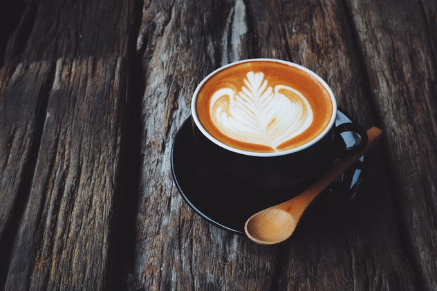 Coffee latte art on wooden background - бесплатный image #187103