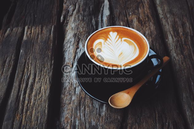 Coffee latte art on wooden background - бесплатный image #187103