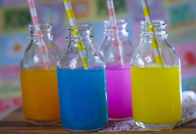 Bottles of colorful drinks - Free image #187623