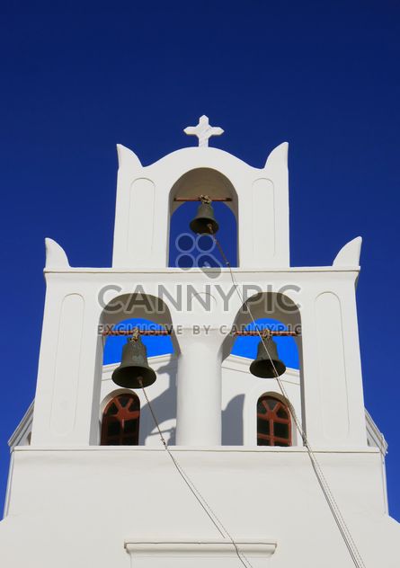White bell tower in Oia - image #187803 gratis