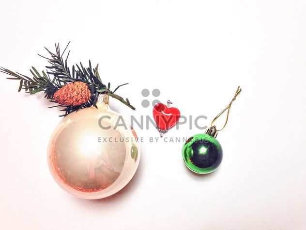 Christmas toys and coniferous tree branch - image #198963 gratis