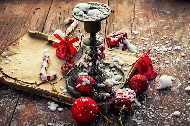 Candlestick, old book and Christmas decorations - бесплатный image #302023