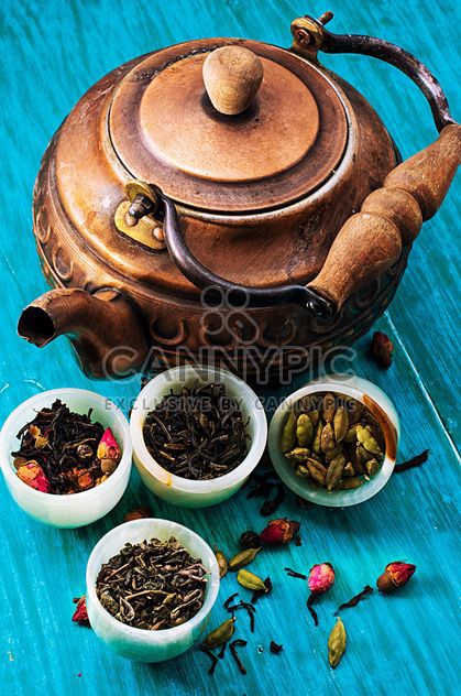 Copper teapot and dry tea in small bowls - Free image #302083