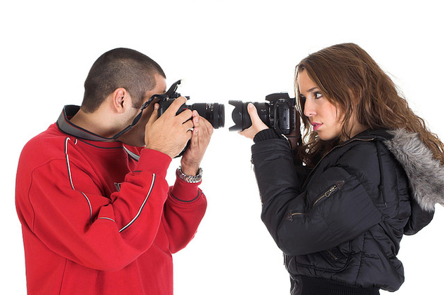 Young man and woman taking pictures of each other - image #313993 gratis