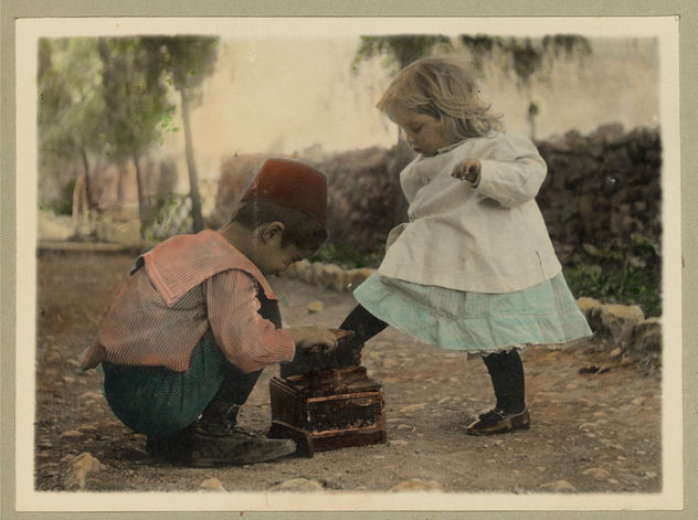 Vintage Picture of Two Children, A Cute Boy giving a Shoe Shine to a Beautiful Little Blonde Girl - image #314143 gratis