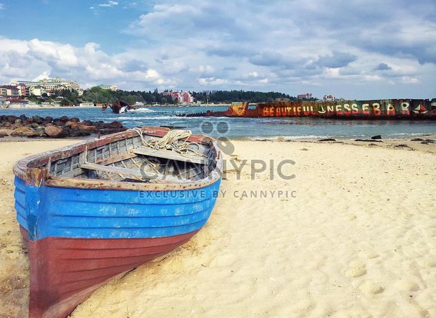 Fishing boat on a beach - Free image #317393