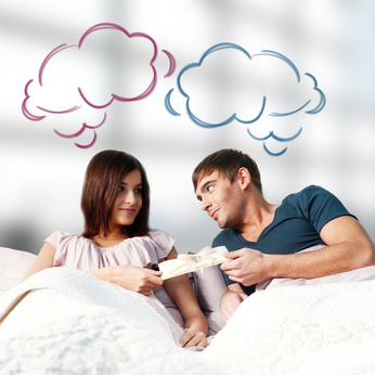 Closeup portrait of adult couple lying on their bed at their apa - Free image #317953
