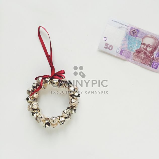 Christmas wreath and money on a white background - бесплатный image #329243