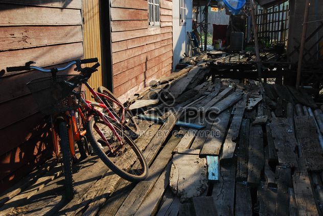Bicycles near old wooden hut - бесплатный image #330333