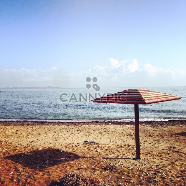 Beach umbrella on seashore - бесплатный image #331763