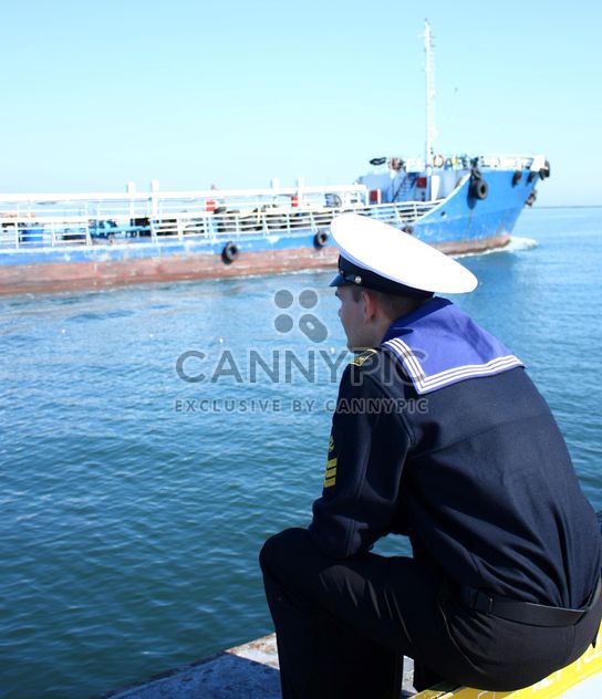 Odessa sailor looking on a ship in port - Free image #342593