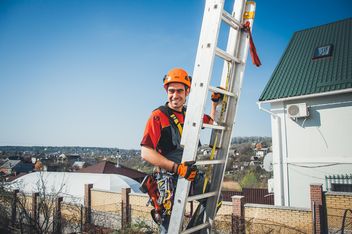 Happy industrial climber on stepladder - image #344533 gratis