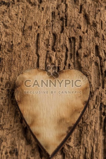 Wooden heart on wooden background - бесплатный image #345093