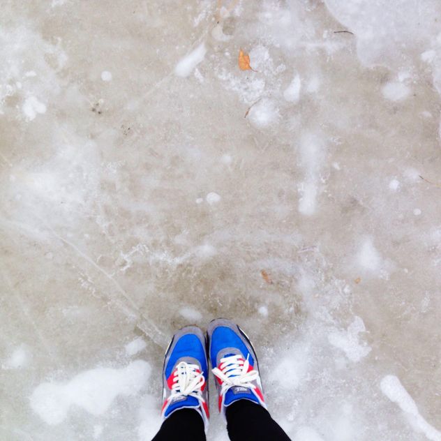 Feet in colorful sneakers on ice - image #347173 gratis