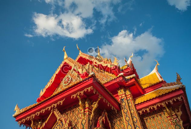 Thai temple against blue sky, view from below - Free image #347193
