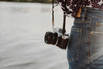 Lifestyle photo of a vintage film camera on a girl. Sea background.jpg - Free image #454473